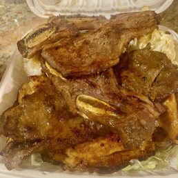 Overwhelming amount of meat you can't tell but underneath the kalbi is a ton Teri beef,  BBQ chicken, rice and Mac salad.