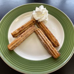 Fresh, not frozen churros with cream.