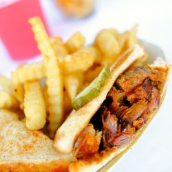 Our trademark barbecue sauce brings out the great flavor in this hot sandwich, served on toast. Includes a choice of one side.