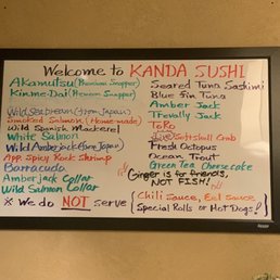 a whiteboard with a list of food items