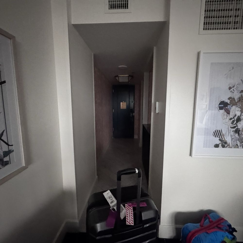 The hallway into the room. Coffee and bathroom are to the right in the hallway The hallway into the room. Coffee and bathroom are to the right in the hallway