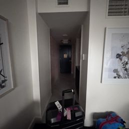 The hallway into the room. Coffee and bathroom are to the right in the hallway