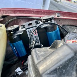 Bad installation of ARB compressor above the hood line, tank relocated and tied to main harness via Zip ties. Bad installation of ARB compressor above the hood line, tank relocated and tied to main harness via Zip ties.