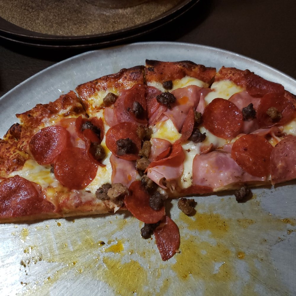 Pizza Vendor - a half eaten pizza on a metal tray - Pizza Near Me - Scappoose, Oregon Pizza Vendor - a half eaten pizza on a metal tray - Pizza Near Me - Scappoose, Oregon