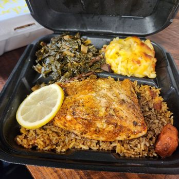 Mangos Cafe And Specialty store - Garlic salmon with herbs served with dirty rice or seasoned yellow rice and 2 additional sides. - Caribbean Near Me - Temple Terrace, Florida Mangos Cafe And Specialty store - Garlic salmon with herbs served with dirty rice or seasoned yellow rice and 2 additional sides. - Caribbean Near Me - Temple Terrace, Florida