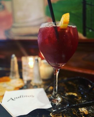 Photo of Andino's - Providence, RI, US. a glass of wine with a slice of orange