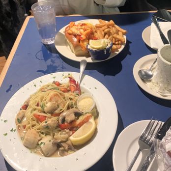 Boston Sail Loft - Foreground: Sauteed Seafood Portofino Background: New England Lobster Roll Mostly consumed New England Clam Chowder on the right - Bars Near Me - Boston, Massachusetts