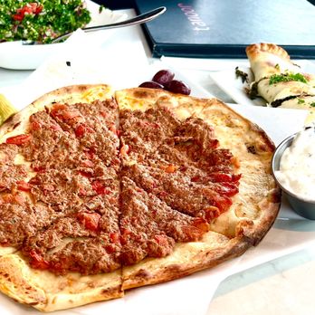 Tanoor - Lahmeh Bajeen: baked flatbread pizza with seasoned ground beef & lamb (great with some salad) $14.    4* - Lebanese Near Me - Sammamish, Washington