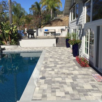 A Omega Construction - a pool and patio area - Landscaping Near Me