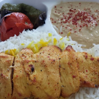 Caravan Restaurant - Chicken breast kabob with a tomato and pepper, and hummus. - Mediterranean Near Me - Glendale, California Caravan Restaurant - Chicken breast kabob with a tomato and pepper, and hummus. - Mediterranean Near Me - Glendale, California