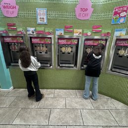 Girls getting their yogurts. Girls getting their yogurts.