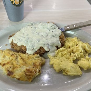 The Toasted Yolk Cafe - Scrambled eggs, with chicken fried steak, and Side Hashbrown Casserole - Breakfast & Brunch Near Me - Humble, Texas