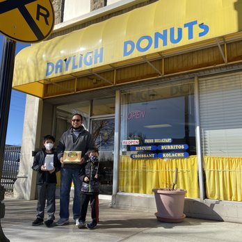 Daylight Donuts - a man and two children standing in front of a donut shop - Donuts Near Me - Hutchinson, Kansas
