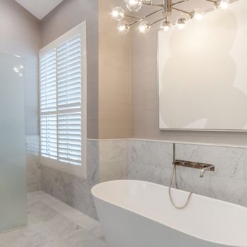 NEO Construction Group - a bathtub and shower in a bathroom - General Contractors Near Me - Doral, Florida NEO Construction Group - a bathtub and shower in a bathroom - General Contractors Near Me - Doral, Florida