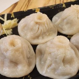 So delicious! Pork soup dumplings.  I pin pricked the top of mine and poured some sauce in each one