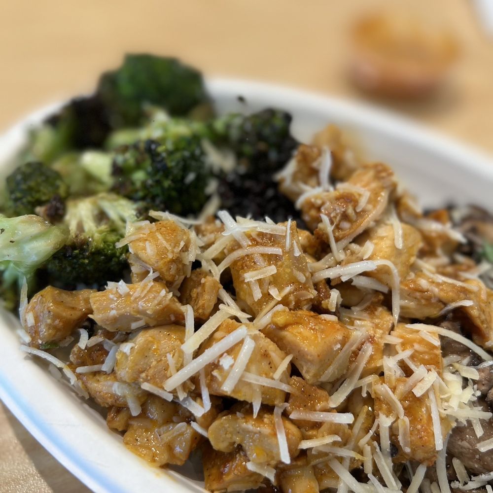 Bolay - a plate of food with broccoli and chicken - New American Near Me - Hollywood, Florida Bolay - a plate of food with broccoli and chicken - New American Near Me - Hollywood, Florida