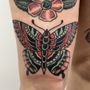 Photo of Black Rose and Dagger Tattoo