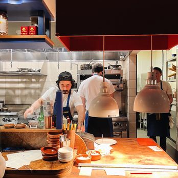 Como Taperia - a group of chefs working in a commercial kitchen - Tapas Bars Near Me - Vancouver, British Columbia Como Taperia - a group of chefs working in a commercial kitchen - Tapas Bars Near Me - Vancouver, British Columbia