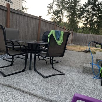 NorthWest Services Insulation and Landscaping - a patio with a table and chairs - Landscaping Near Me