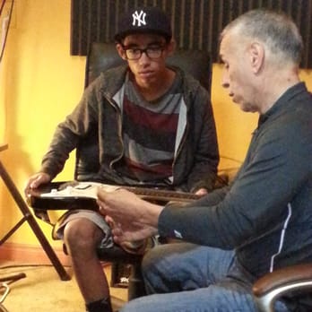 Guitar Lesson Source - Xavier teaching my son how to string up an electric guitar. - Musical Instruments & Teachers Near Me - Whittier, California