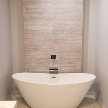 Allied Construction - a bathtub in a bathroom - General Contractors Near Me - Port Jefferson Station, New York Allied Construction - a bathtub in a bathroom - General Contractors Near Me - Port Jefferson Station, New York