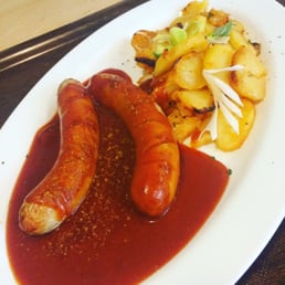 Currywurst and potatoes. Currywurst and potatoes.