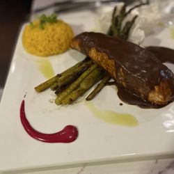 Golden Jalapeno Tex Mex - Salmon with Mole sauce yellow rice and grilled asparagus