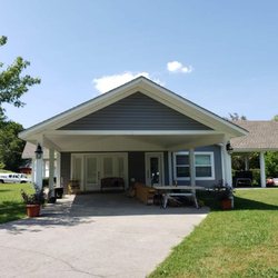 Zampolli Construction - Vinyl siding and soffit, 5.25in wood trim to cap bottom of the gable.