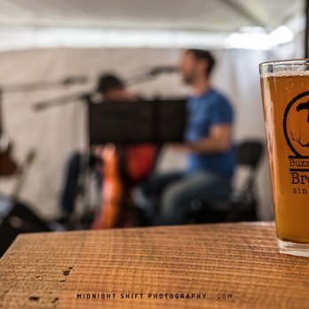 Buzzards Bay Brewing - Enjoying a pint while some local musical talent plays inside of the tent just outside of the brewhouse - Breweries Near Me - Westport, Massachusetts Buzzards Bay Brewing - Enjoying a pint while some local musical talent plays inside of the tent just outside of the brewhouse - Breweries Near Me - Westport, Massachusetts