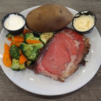 Junction Bar & Grill - Prime Rib Petite Cut with baked potato and seasonal veggies - Sports Bars Near Me - San Diego, California Junction Bar & Grill - Prime Rib Petite Cut with baked potato and seasonal veggies - Sports Bars Near Me - San Diego, California
