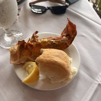 PIER 22 - Shell of 8 ounce lobster that came out very quick easily and a warm piece of bread with herb butter on the plate as well!! - New American Near Me - Bradenton, Florida PIER 22 - Shell of 8 ounce lobster that came out very quick easily and a warm piece of bread with herb butter on the plate as well!! - New American Near Me - Bradenton, Florida