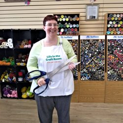 Life in the Craft Room - Kimberly holding giant ribbon-cutting scissors