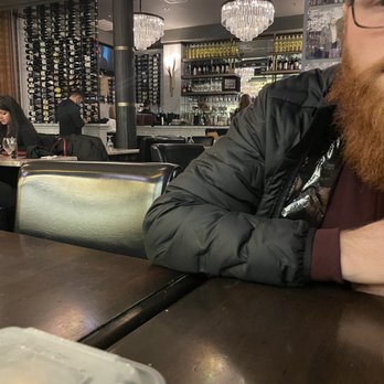 Strega - Waiting for our check while servers are on their phone in the dining room - Italian Near Me - Boston, Massachusetts Strega - Waiting for our check while servers are on their phone in the dining room - Italian Near Me - Boston, Massachusetts