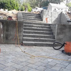 Green Triangle Landscaping - Installing paper with steps