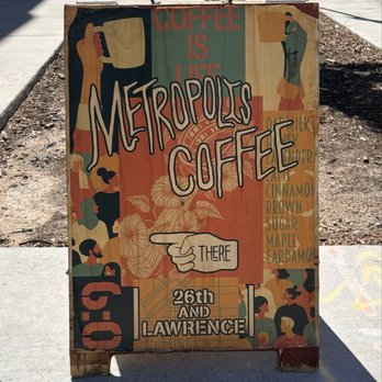 Metropolis Coffee - Colorful store signage on the sidewalk right in front of the shop - Coffee & Tea Near Me - Denver, Colorado