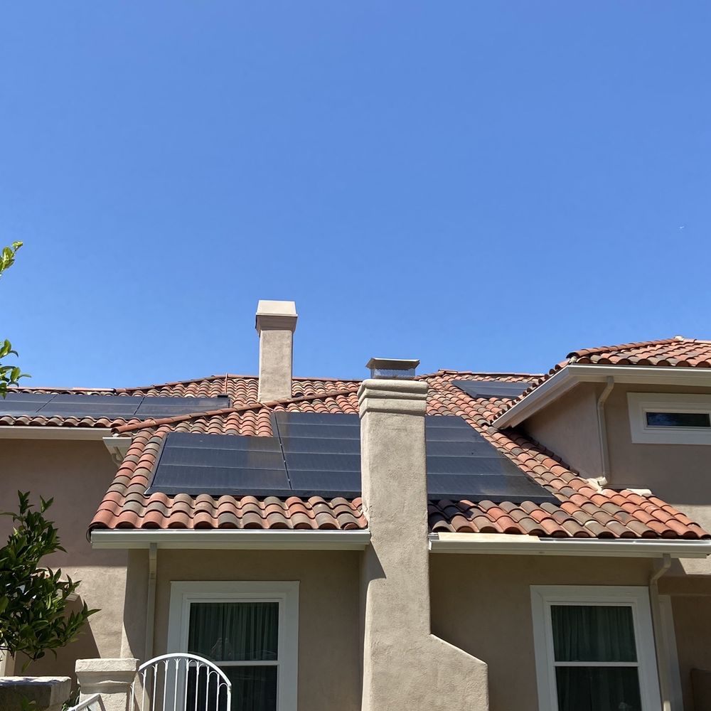 Prestige Roofing - Tesla Solar panels with clay tile roof replaced around the panels. New gutters. - Roofing Near Me - Anaheim, California Prestige Roofing - Tesla Solar panels with clay tile roof replaced around the panels. New gutters. - Roofing Near Me - Anaheim, California