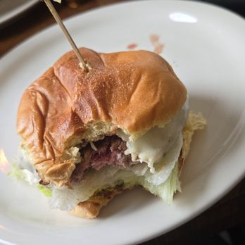 Paloma - Initial bite into the paloma burger - Cocktail Bars Near Me - Santa Barbara, California