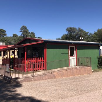 By The Bucket - a green building with a red fence - Italian Near Me - Payson, Arizona By The Bucket - a green building with a red fence - Italian Near Me - Payson, Arizona