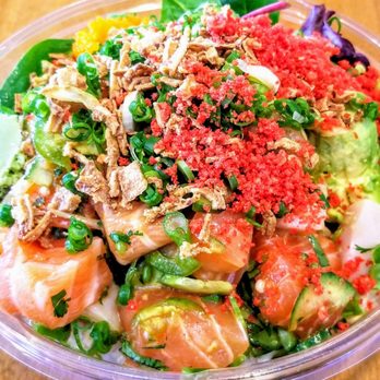 Poke Dot - Salmon, yellowtail, albacore, masago, jalapeños, green unions, onion chips, flaming cheetos, avocado, wasabi, over brown rice and greens. - Seafood Near Me - Irvine, California Poke Dot - Salmon, yellowtail, albacore, masago, jalapeños, green unions, onion chips, flaming cheetos, avocado, wasabi, over brown rice and greens. - Seafood Near Me - Irvine, California