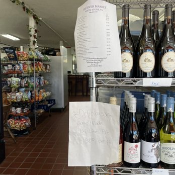 The River Market - a wine rack with bottles of wine - Grocery Near Me - White Stone, Virginia The River Market - a wine rack with bottles of wine - Grocery Near Me - White Stone, Virginia