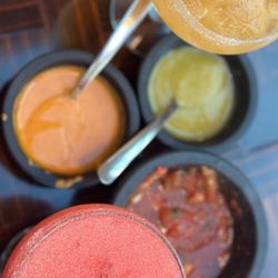 El Senorial - frozen strawberry margarita, on-the-rocks mango margarita, and complimentary salsas that come with a basket of chips.