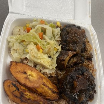Island Sizzle - Lunch portion of Ox tails - Caribbean Near Me - Houston, Texas Island Sizzle - Lunch portion of Ox tails - Caribbean Near Me - Houston, Texas