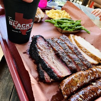 Terry Black's Barbecue - From left to right to bottom: sliced brisket, pork ribs, turkey, jalapeno & cheddar sausage. Top: mac n cheese, green beans - Barbeque Near Me - Austin, Texas Terry Black's Barbecue - From left to right to bottom: sliced brisket, pork ribs, turkey, jalapeno & cheddar sausage. Top: mac n cheese, green beans - Barbeque Near Me - Austin, Texas