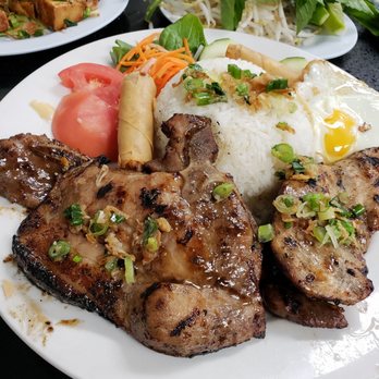 Pho 79 - #51 chicken, pork chop, and short ribs served with rice and egg rolls - Vietnamese Near Me - Davie, Florida Pho 79 - #51 chicken, pork chop, and short ribs served with rice and egg rolls - Vietnamese Near Me - Davie, Florida