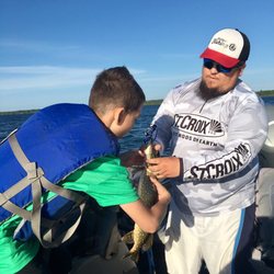 Jesse helping him take it off the hook.