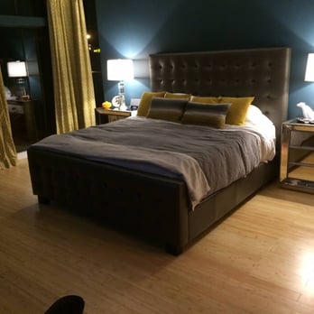 Deca Floors - a bedroom with a bed, nightstands, and lamps - Flooring Near Me Deca Floors - a bedroom with a bed, nightstands, and lamps - Flooring Near Me