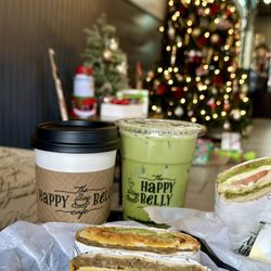 The Happy Belly Cafe - Limited Hearty Breakfast Wrap, the Chicken Caprese Panini, 16 oz. Hot Chocolate, and the 16 oz. Matcha Latte