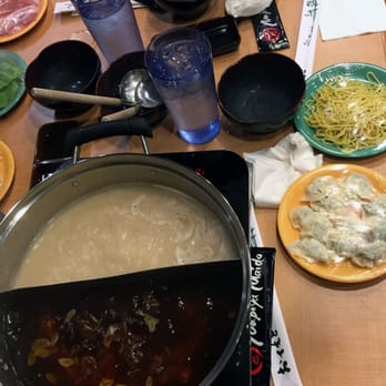 Nabeya Maido - Wide shot of our hot pot broth and side dishes. - Japanese Near Me - Honolulu, Hawaii Nabeya Maido - Wide shot of our hot pot broth and side dishes. - Japanese Near Me - Honolulu, Hawaii