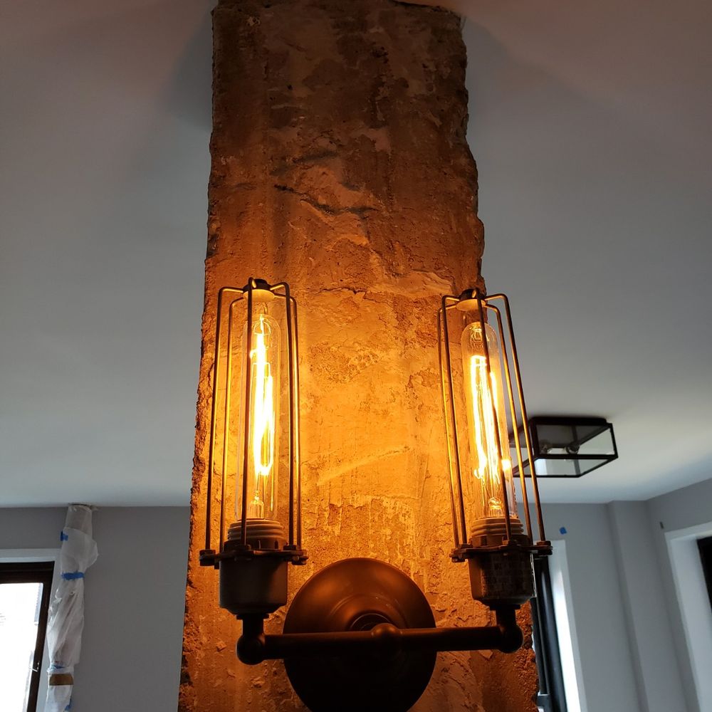 Agalliu Contracting - We had to keep this load-bearing column, but Matt stripped it to the bare concrete at our request - General Contractors Near Me - New York, New York