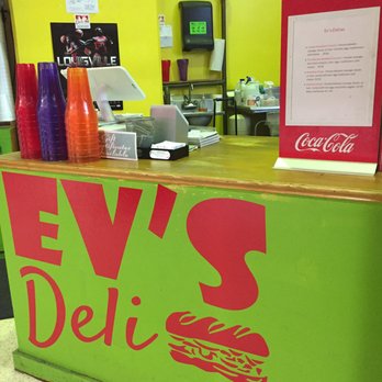 Ev's Deli - a neon green counter with a neon red sign - Delis Near Me - Louisville, Kentucky Ev's Deli - a neon green counter with a neon red sign - Delis Near Me - Louisville, Kentucky